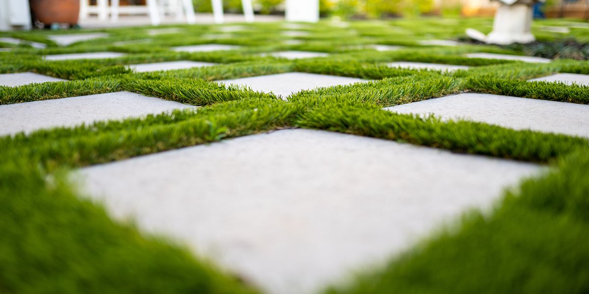 How to Install Artificial Grass Strips Between Pavers
